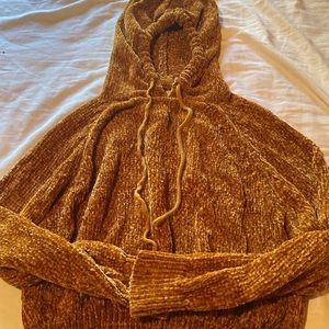 It’s a very comfy sweater the brand is planet gold and it’s a size small